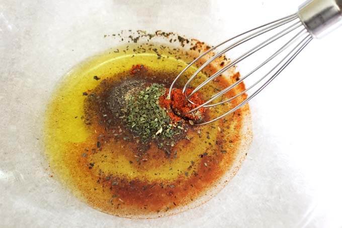 Mix the oil and spices together in glass bowl