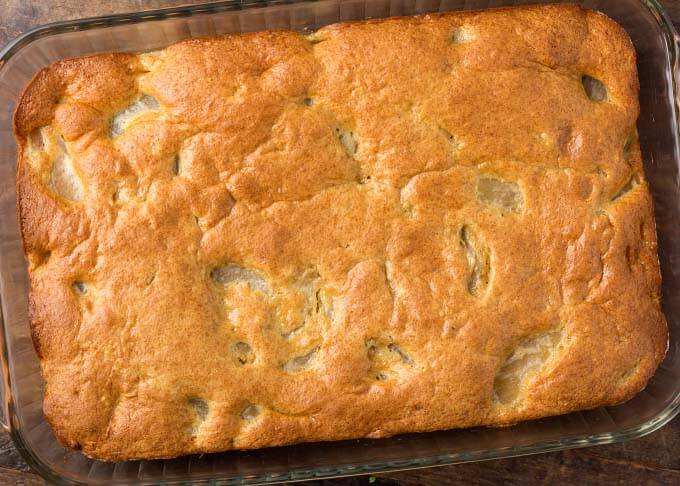 Cake without frosting in glass casserole dish