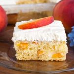 Slice of Easy Peach Potluck Cake on glass plate