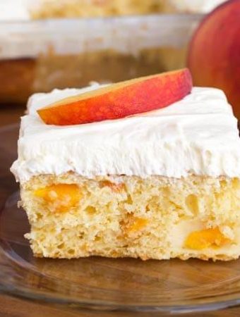 Slice of Easy Peach Potluck Cake on glass plate