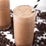 Iced Coffee Protein Shakes surrounded by coffee beans