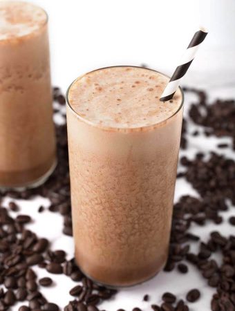 Iced Coffee Protein Shakes surrounded by coffee beans