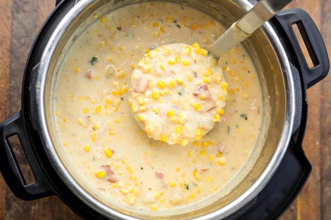 Top view of Corn Chowder in pressure cooker with ladle