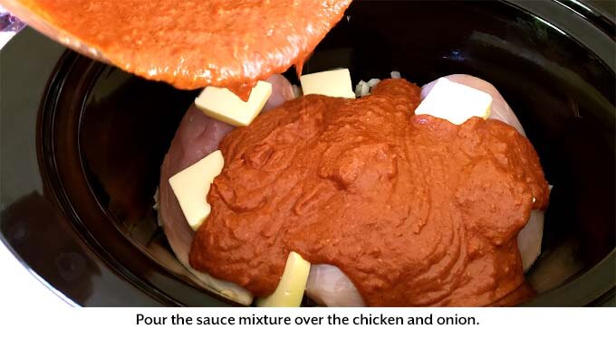 Pouring sauce over chicken in slow cooker