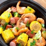 Slow Cooker Shrimp Boil in a black crock