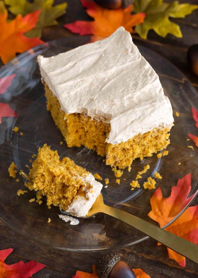 Pumpkin Cake with Cinnamon Butterscotch Frosting on a glass plate with fork