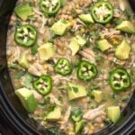 White Chicken Chili topped with diced avocado and sliced fresh jalapenos