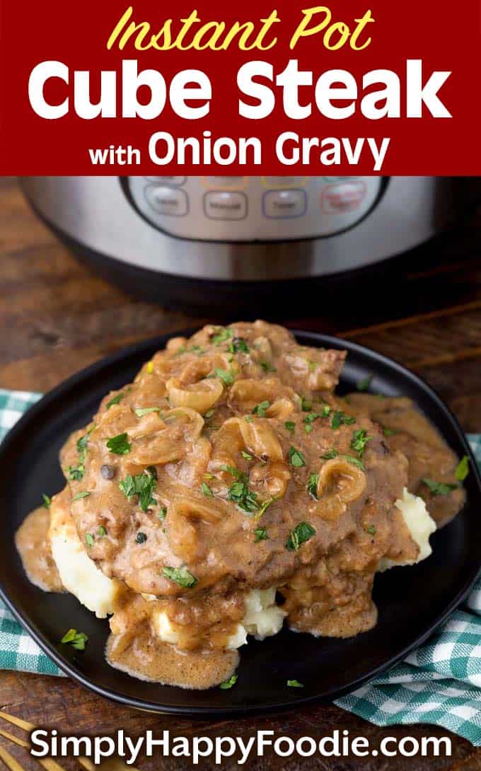 Instant Pot Cube Steak with Onion Gravy on black plate as well as title and Simply Happy Foodie.com logo