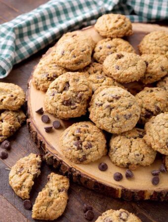 Several Chocolate Chip Oatmeal Cookies on round wooden board