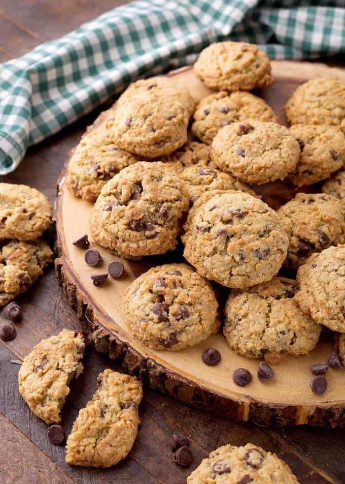 Several Chocolate Chip Oatmeal Cookies on round wooden board