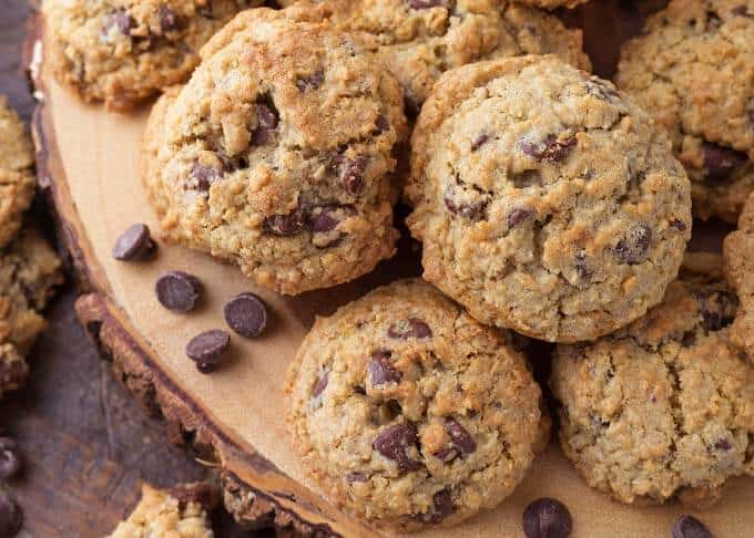 Close up of Chocolate Chip Oatmeal Cookies on round wooden board