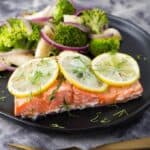 Instant Pot Lemon Butter Salmon and Vegetables on black plate