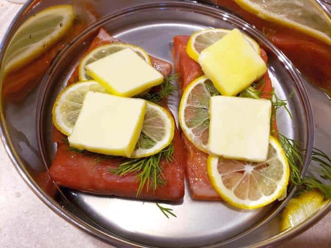 uncooked salmon in pot prepared and ready to cook