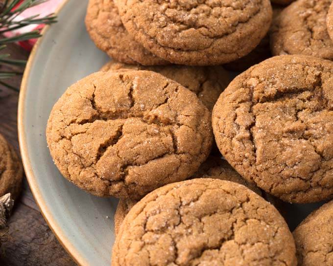 Close up of several Soft Chewy Ginger Cookies on grey plate