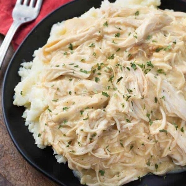 Slow Cooker Chicken and Gravy on black plate