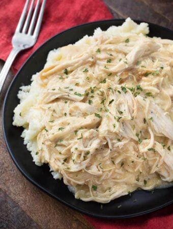 Slow Cooker Chicken and Gravy on black plate