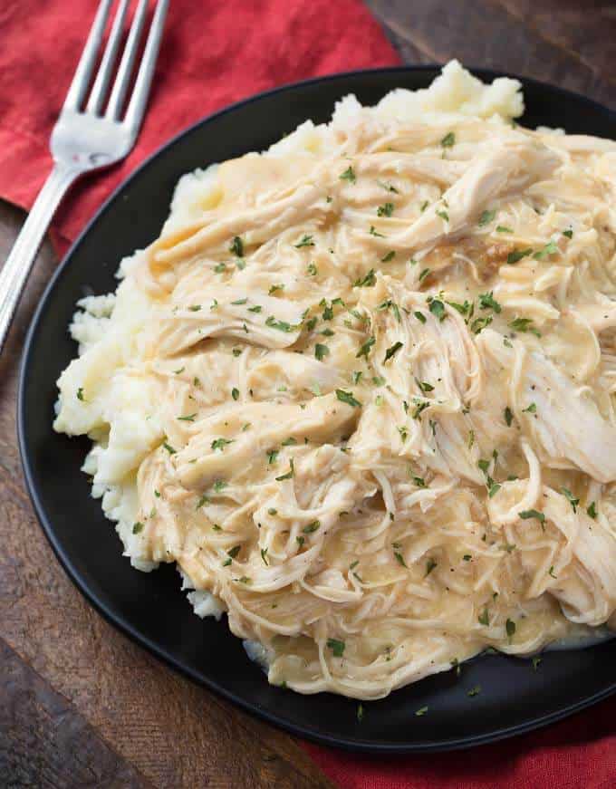 Slow Cooker Chicken and Gravy on black plate