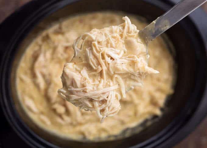 Close up of spoonful of Slow Cooker Chicken and Gravy