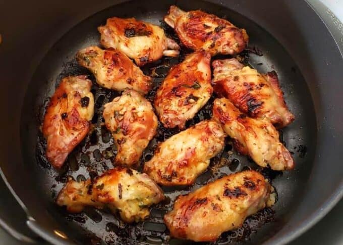 Cooked Chicken Wings in Air Fryer basket