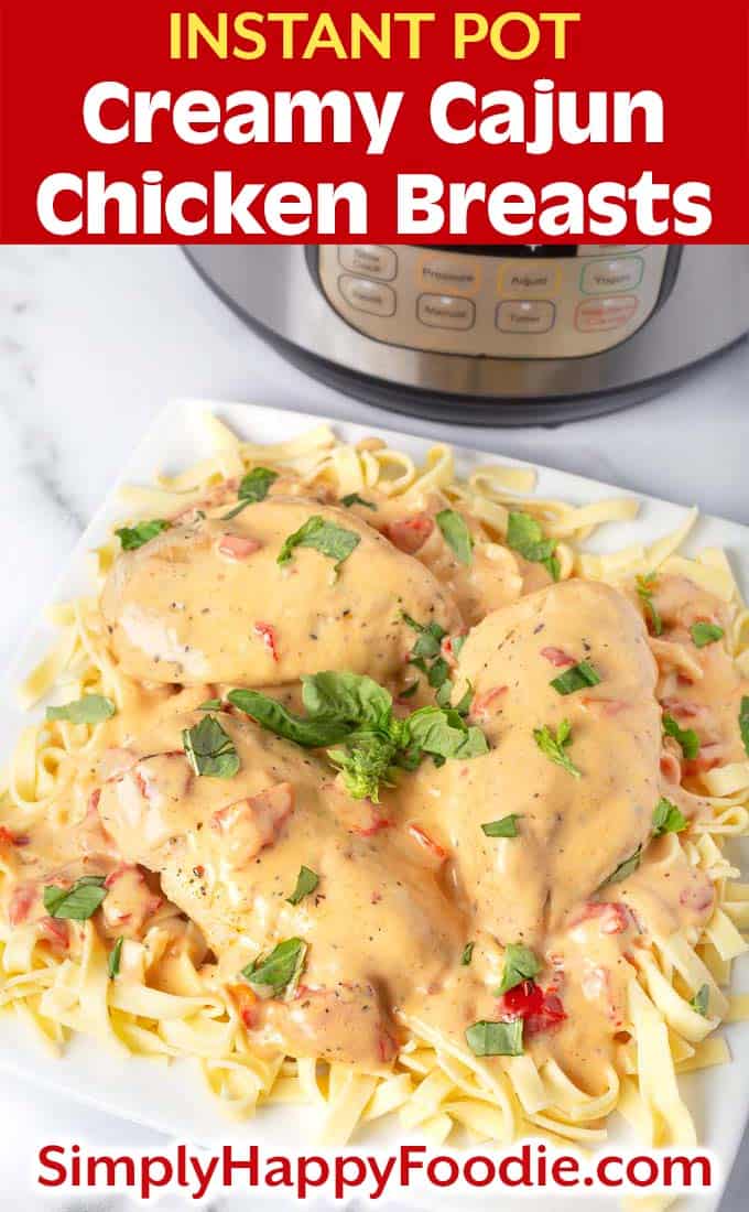 Instant Pot Creamy Cajun Chicken Breasts on white plate with title and simply happy foodie.com logo