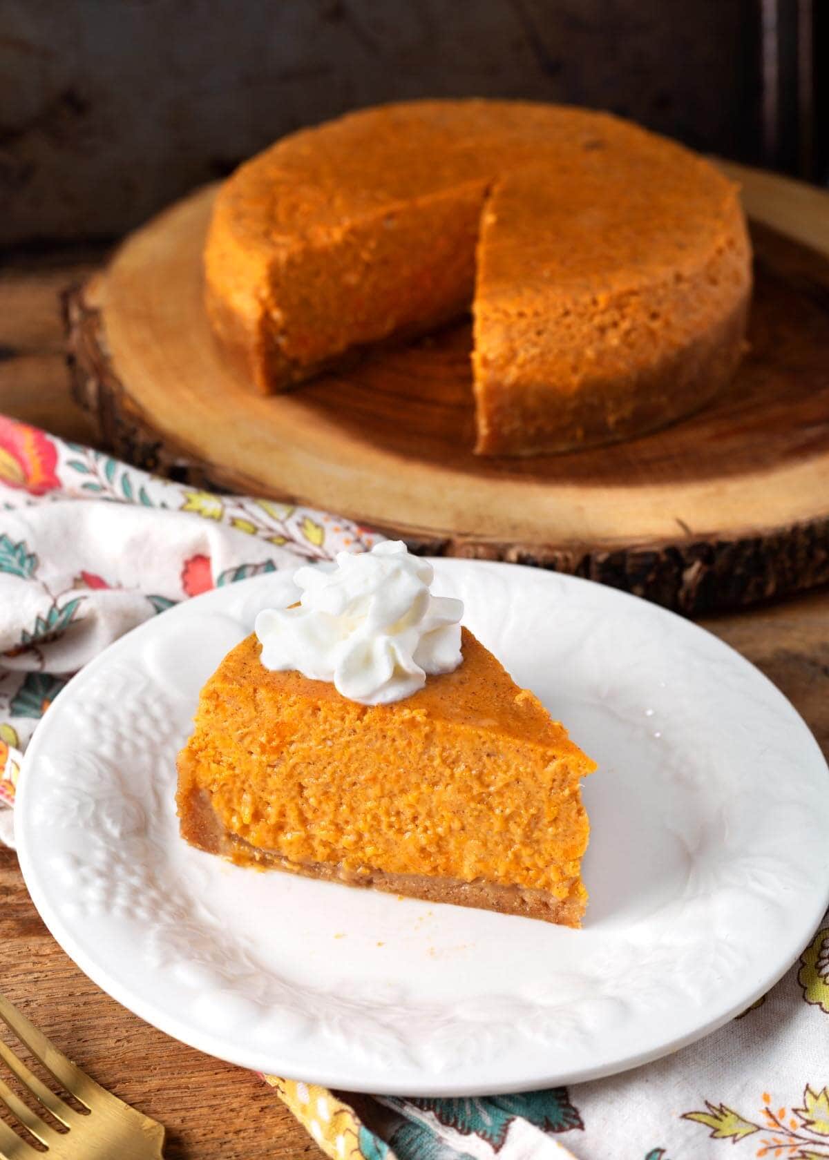 Instant Pot Sweet Potato Pie slice on a white plate.