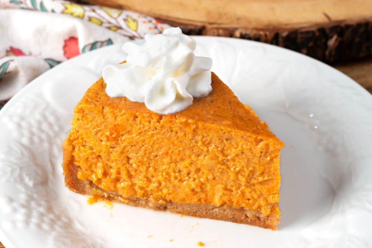 Instant Pot Sweet Potato Pie slice on a white plate.