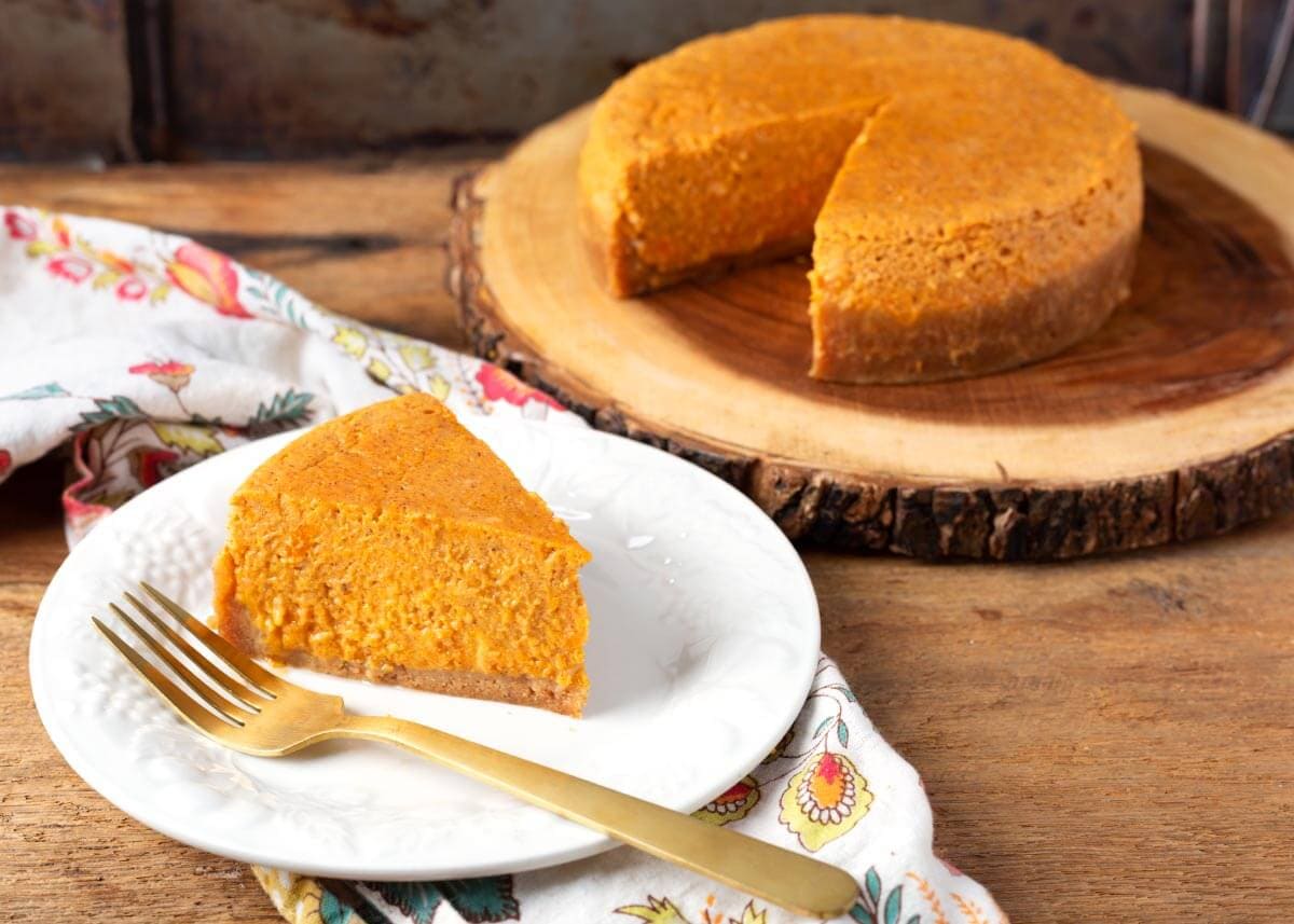 Instant Pot Sweet Potato Pie slice on a white plate.