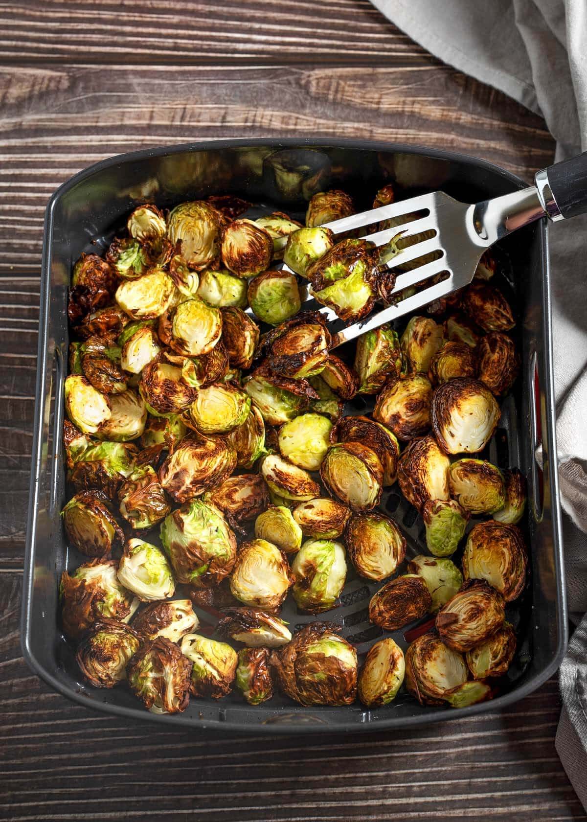 Air Fryer Brussels Sprouts in the air fryer basket