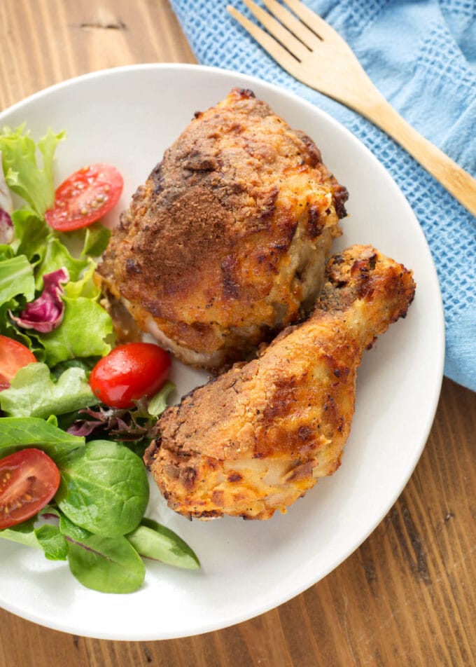 Air Fryer Fried Chicken on a white plate with salad