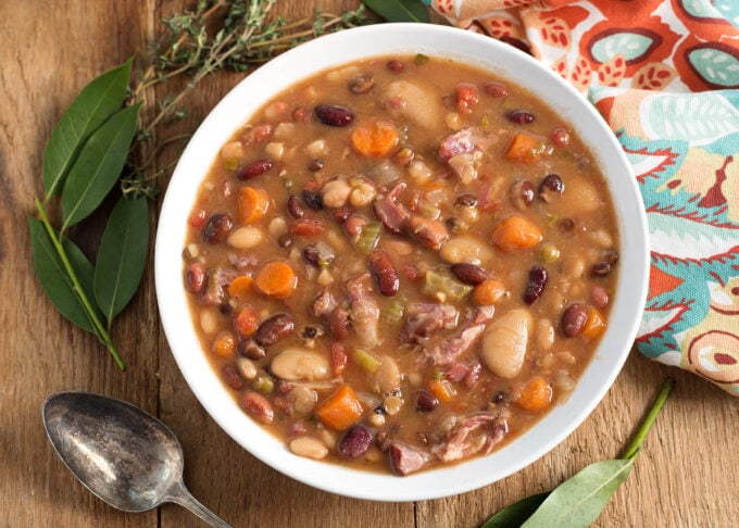 Instant Pot 15 Bean Soup in a white bowl on wood