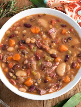 Instant Pot 15 Bean Soup in white bowl on wood