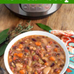 Instant Pot 15 Bean Soup in white bowl on wood