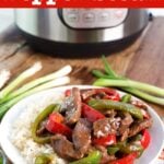 Instant Pot Pepper Steak on a white plate with Instant Pot in background