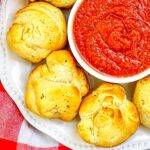 Air Fryer Mozzarella Balls close up with marinara sauce