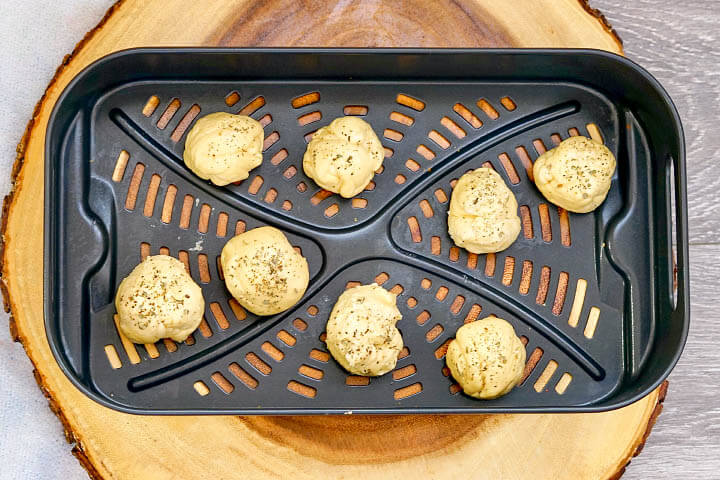 Air Fryer Mozzarella Balls on tray before air frying