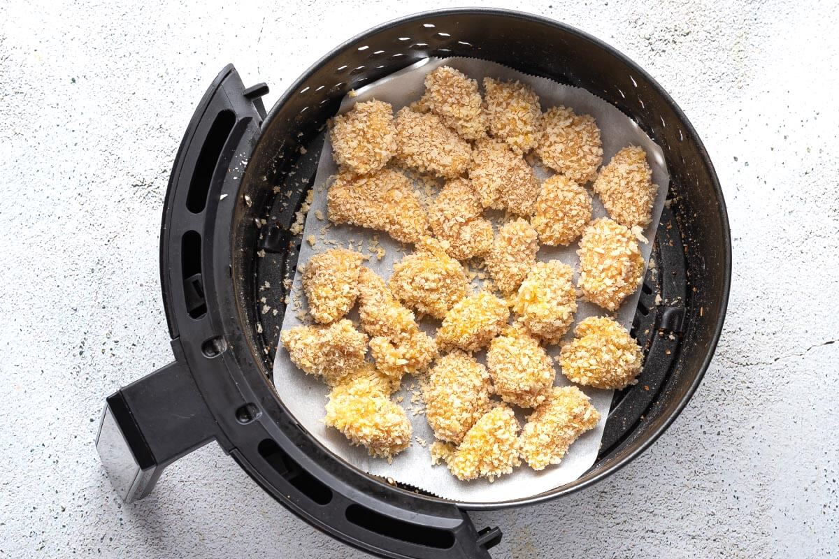 breaded chicken in air fryer basket