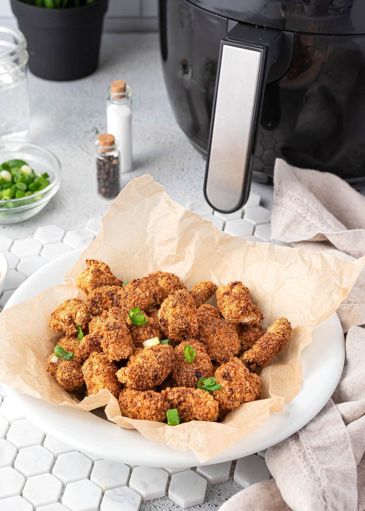 popcorn chicken in a white bowl.