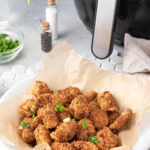 Air Fryer Popcorn Chicken in a white dish