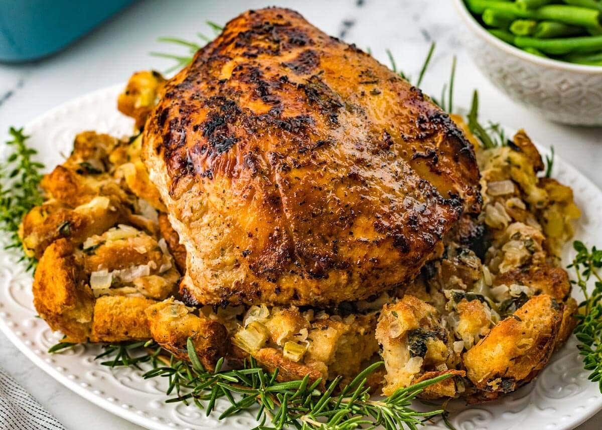 Air Fryer Turkey Breast on a white plate with stuffing