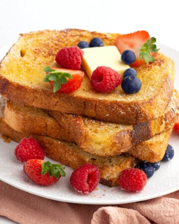 stack of french toast with berries