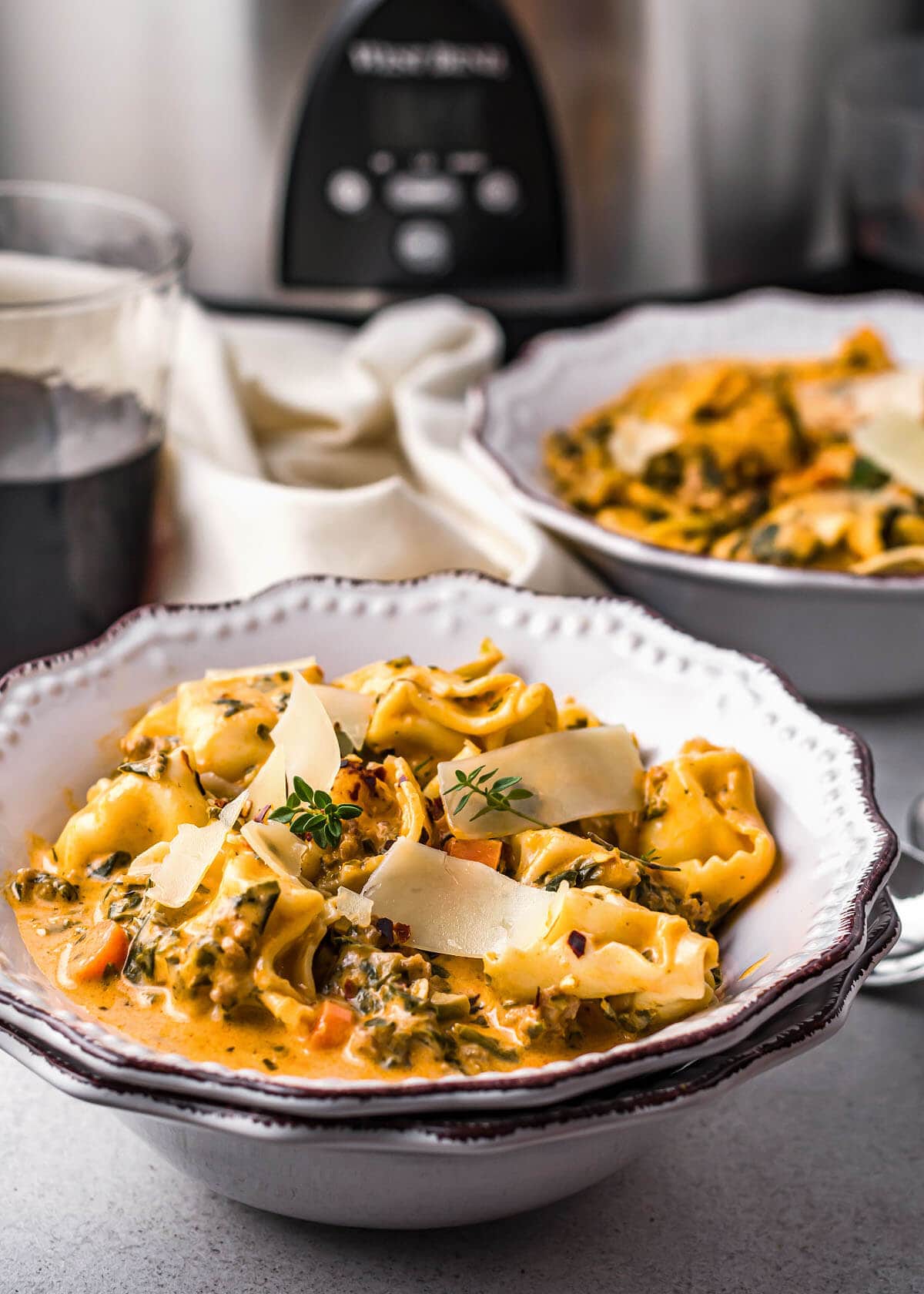 finished Creamy Tortellini Soup in a white bowl