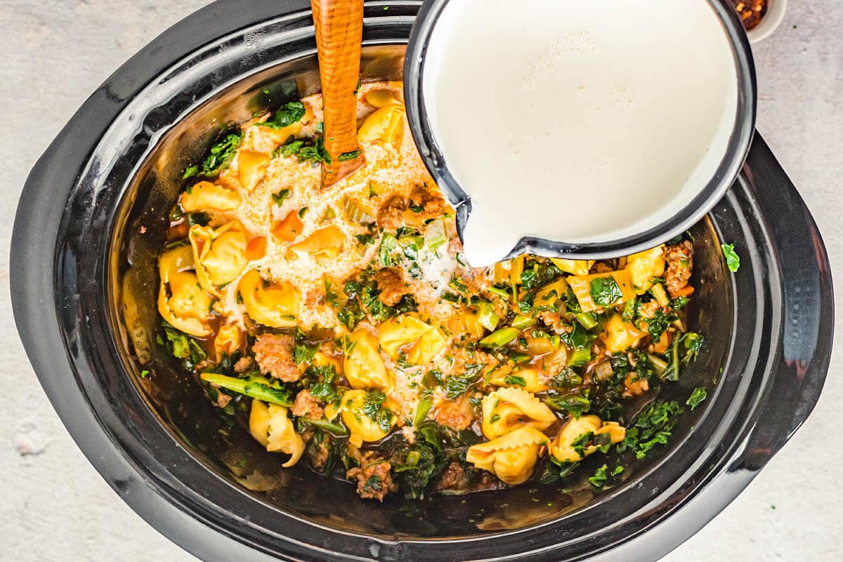 pouring heavy cream into crock