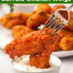 Air Fryer Buffalo Chicken Wing on a fork being dipped