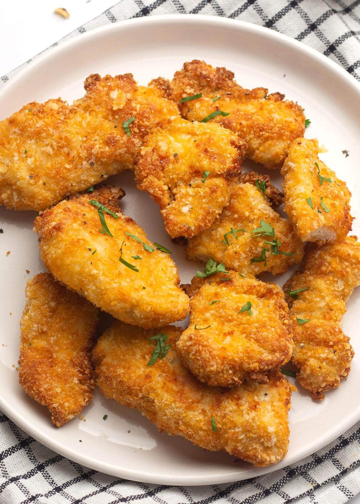 chicken nuggets on a white plate