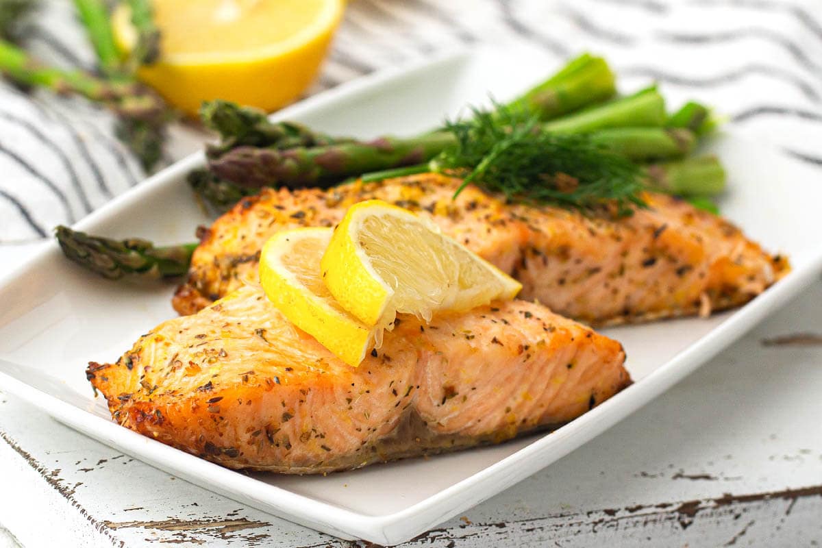 Air Fryer Salmon a white plate with lemon