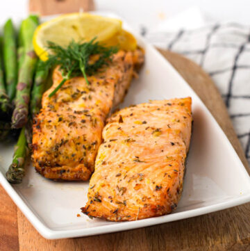 2 pieces Air Fryer Salmon on a white plate