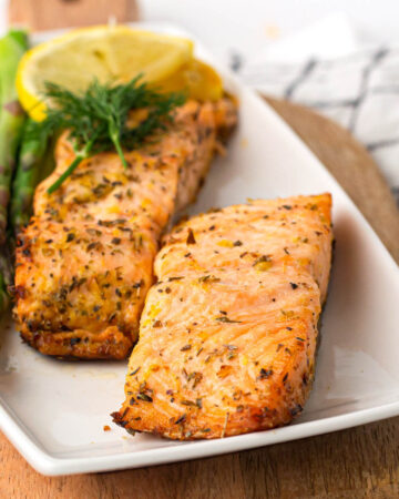 2 pieces Air Fryer Salmon on a white plate