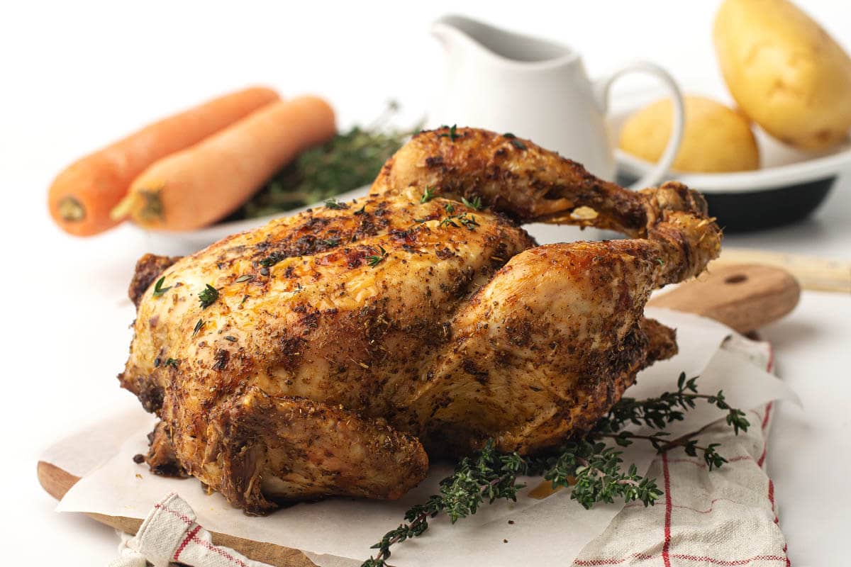 whole chicken on a cutting board