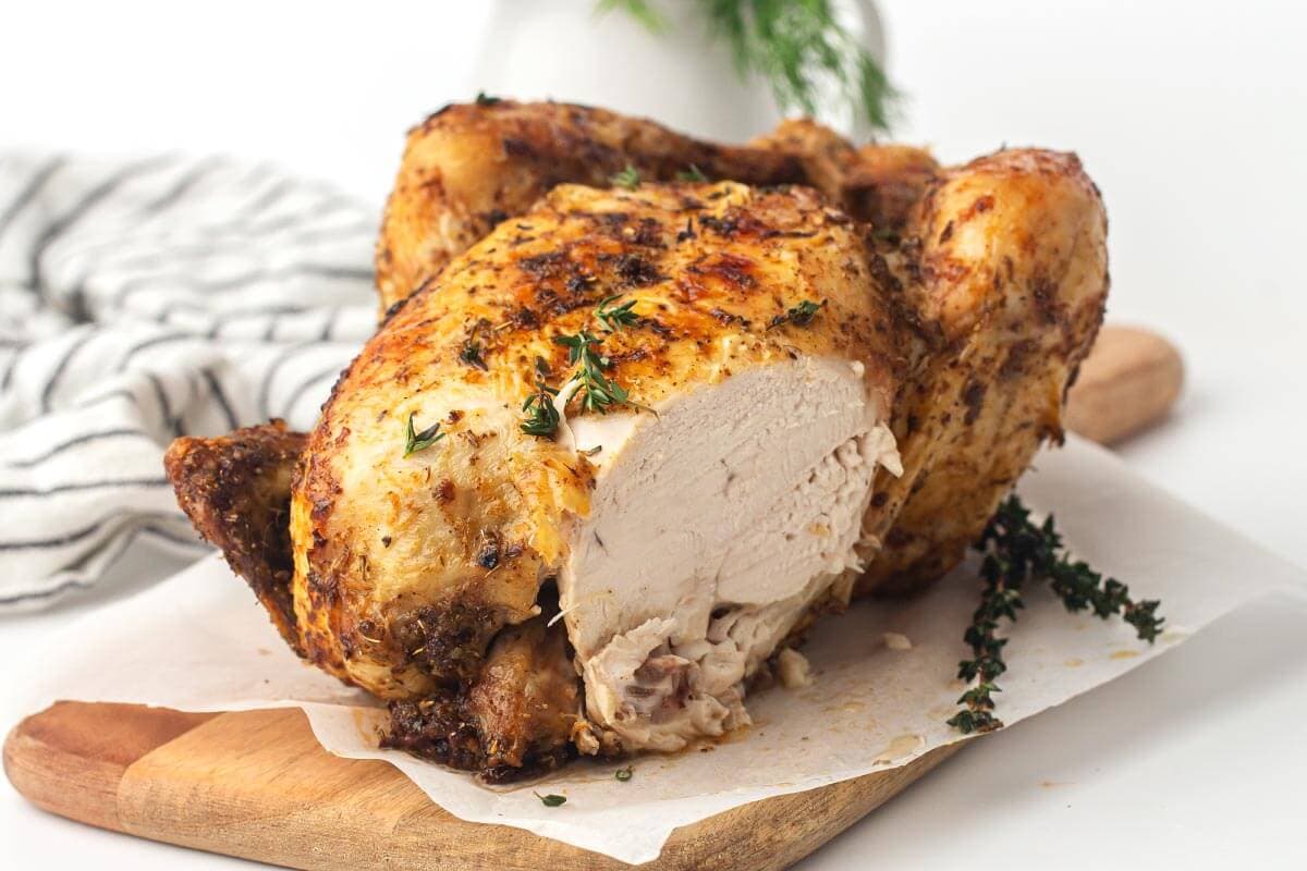 Air Fryer Whole Chicken with slice removed