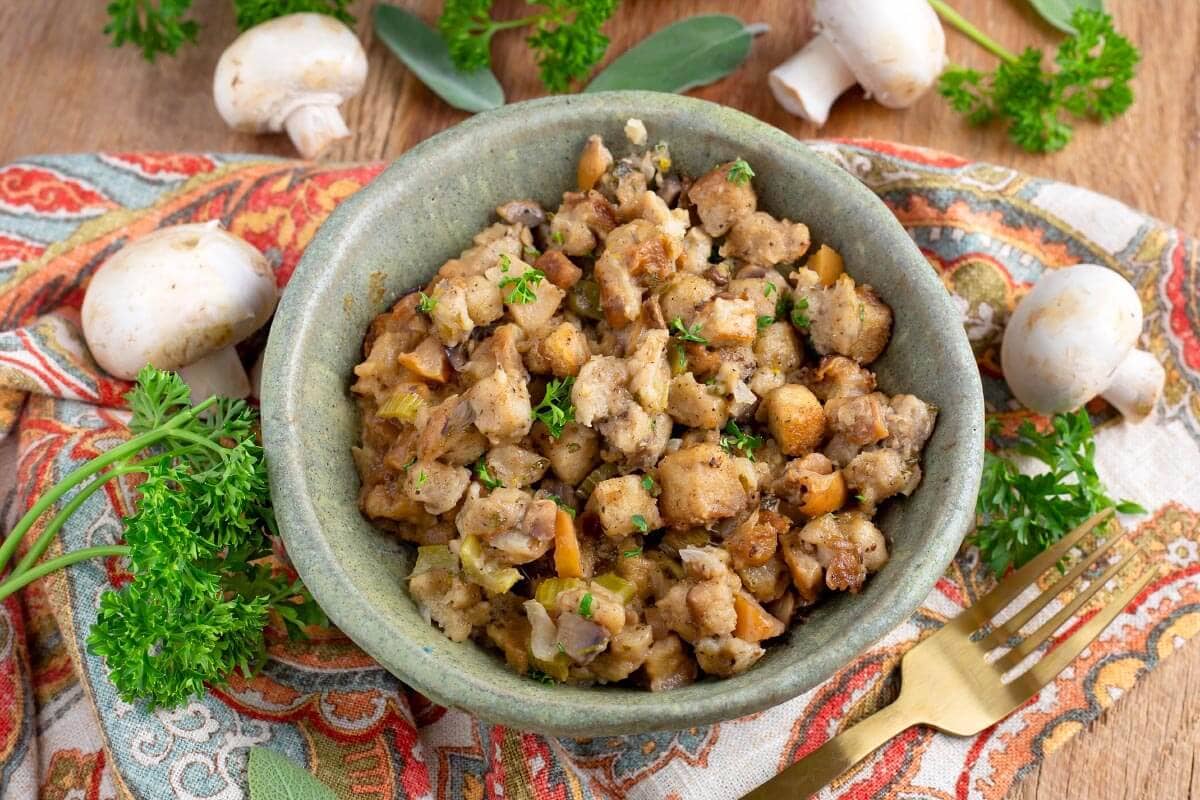 small green bowl with easy slow cooker stuffing in it